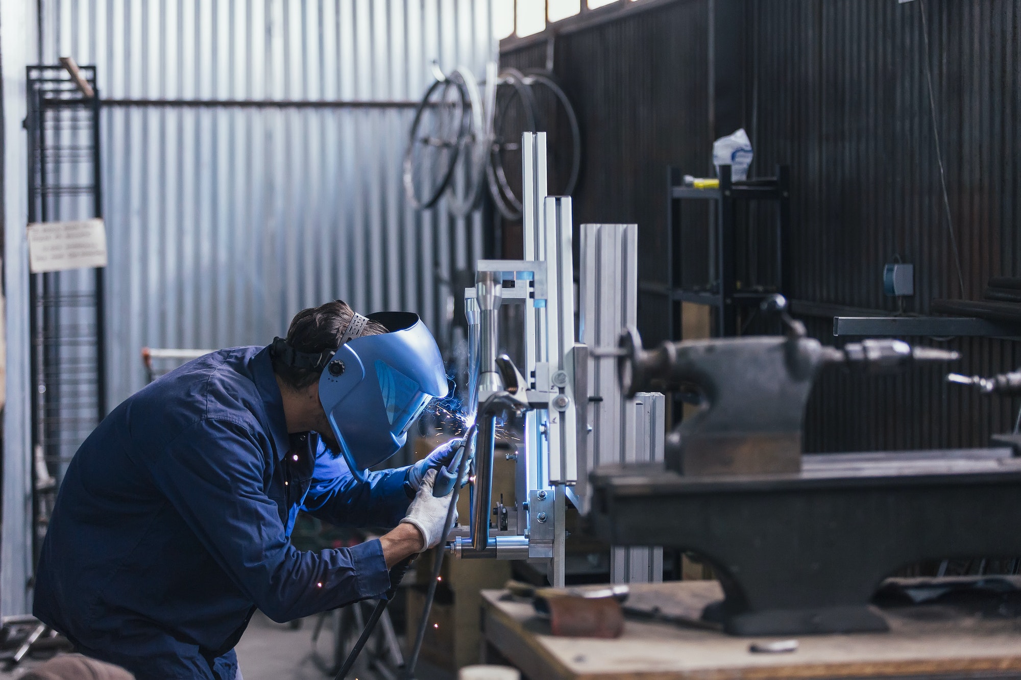 side-view-of-worker-with-welding-machine.jpg