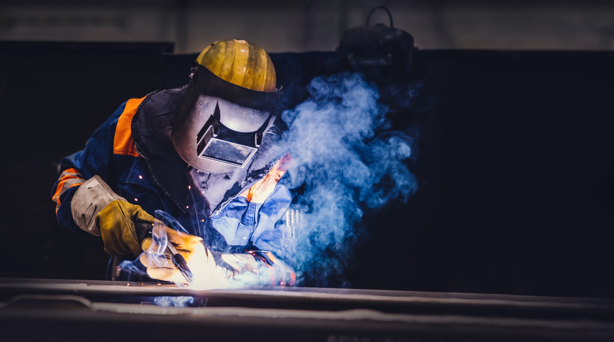 worker-welding-in-a-factory-1-1.jpg