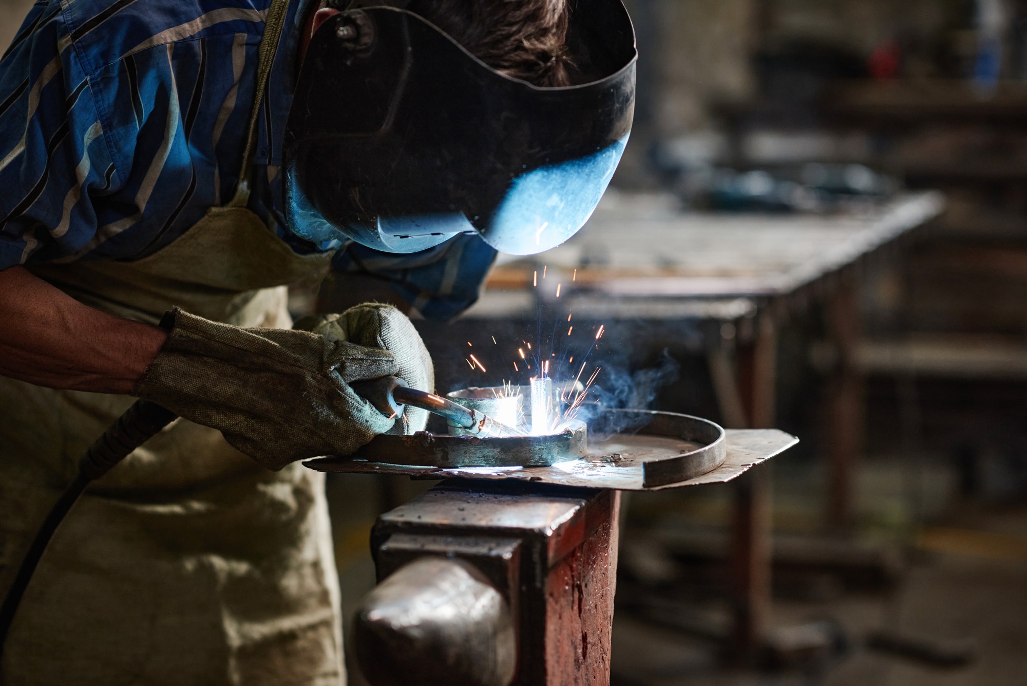worker-with-protective-mask-welding-metal.jpg
